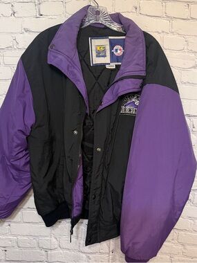 Throwback 90s Colorado Rockies jacket with bold purple + black color blocking —